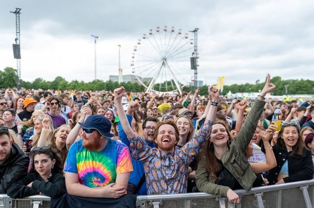Music fans sing and dance in the crowd at TRNSMT in Glasgow Green
