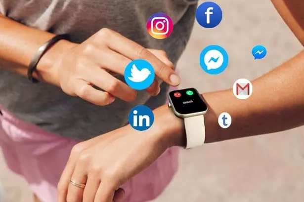 Woman checking smartwatch.