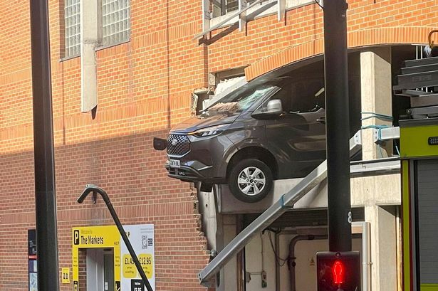 Van hanging out side of a multi-storey car park in Leeds