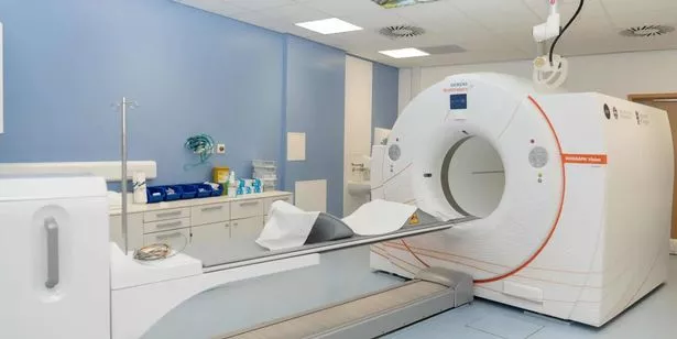 The scanner is pictured in situ in the hospital