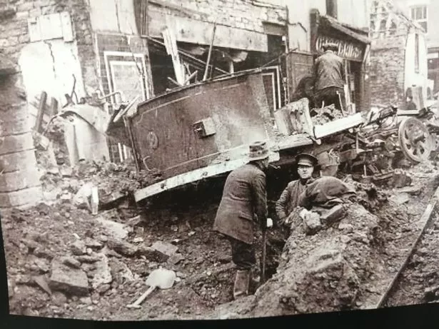 The aftermath of a Luftwaffe air raid on Bedminster, in which a bomb hit a tram travelling along West Street, outside the White Horse pub