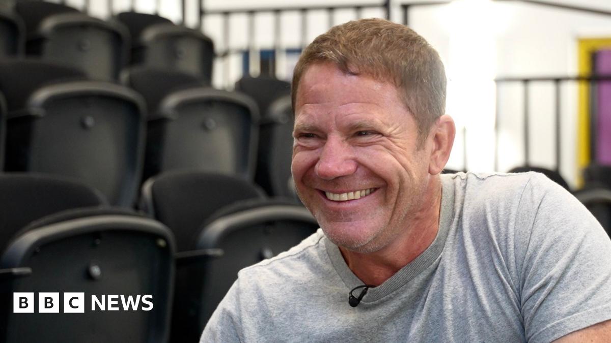 Steve Backshall is pictured smiling and wearing a light coloured T shirt
