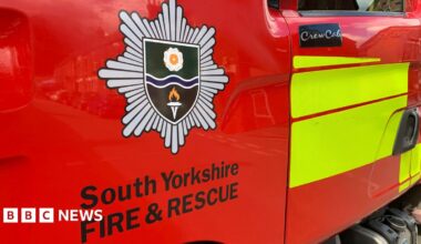 An image of the South Yorkshire Fire and Rescue Service logo on the side of a fire engine.