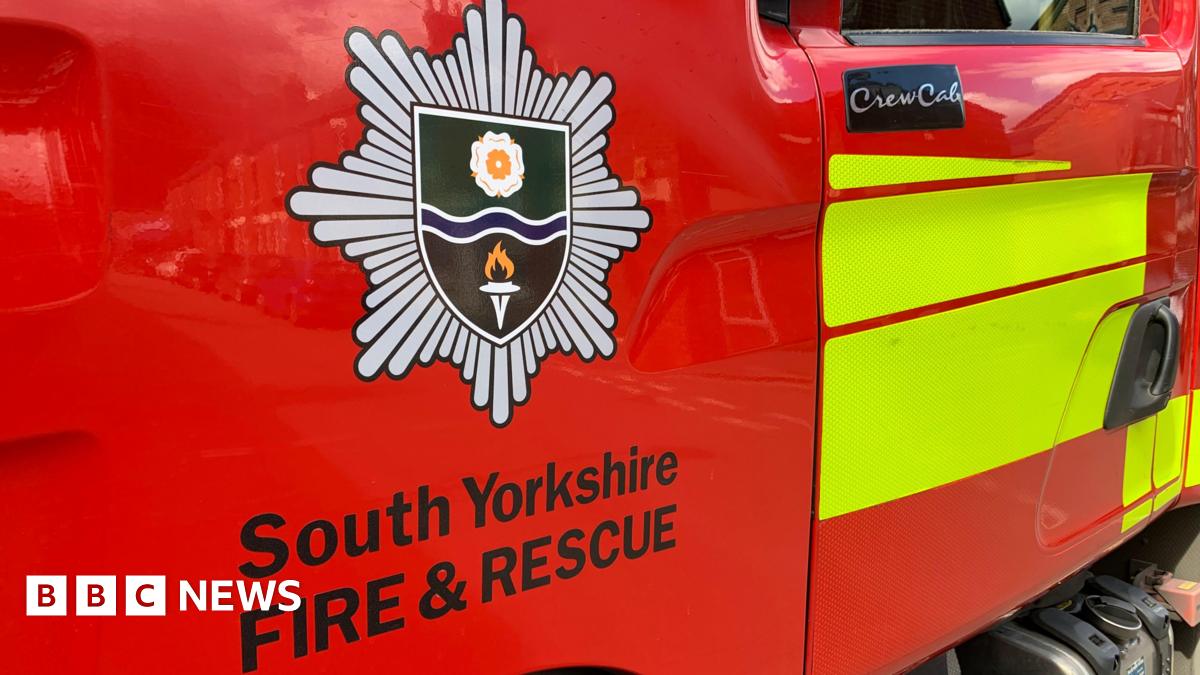 An image of the South Yorkshire Fire and Rescue Service logo on the side of a fire engine.