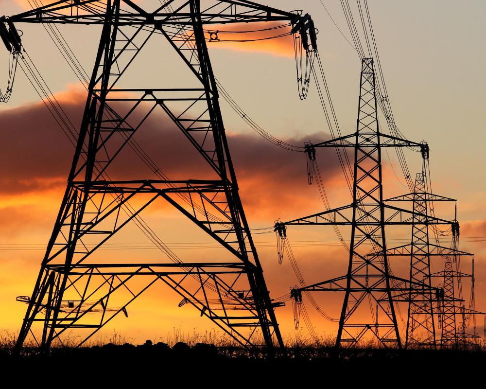 Electricity pylons at sunset near Falkirk