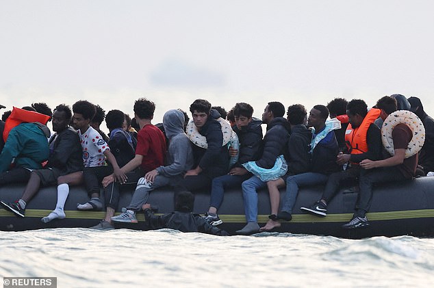 A group of migrants on an inflatable dinghy leave the coast of northern France in an attempt to cross the English Channel to reach Britain, from the beach of Petit-Fort-Philippe in Gravelines, near Calais, France, July 2
