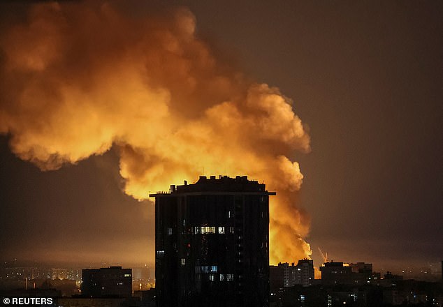 An explosion lights up the night sky over Kyiv, Ukraine, following a Russian drone and missile strike on July 4, 2025