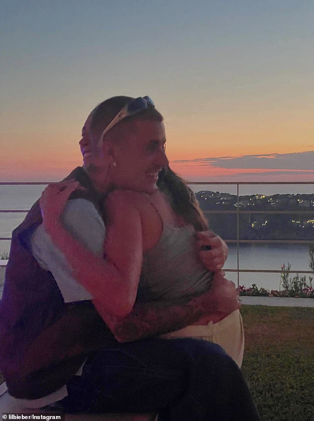 In one snap, Hailey's face could partially be seen smiling as she embraced the back of Justin's head and back but, for the most part, her identity was concealed