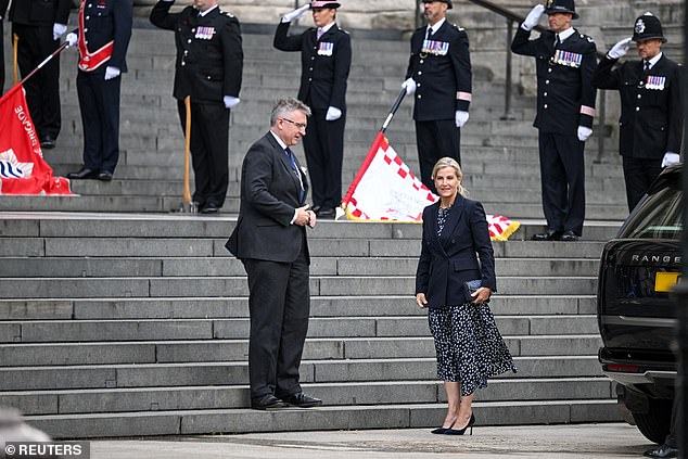 Sophie, Duchess of Edinburgh, stands outside St Paul's Cathedral as members of the Metropolitan Police salute