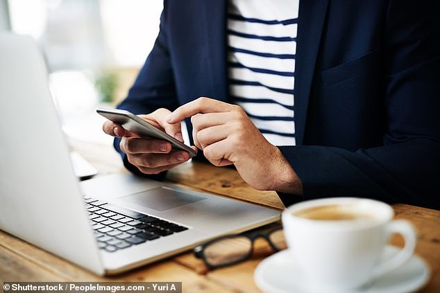 Several studies have warned against the dangers of multitasking with different media screens (stock image)