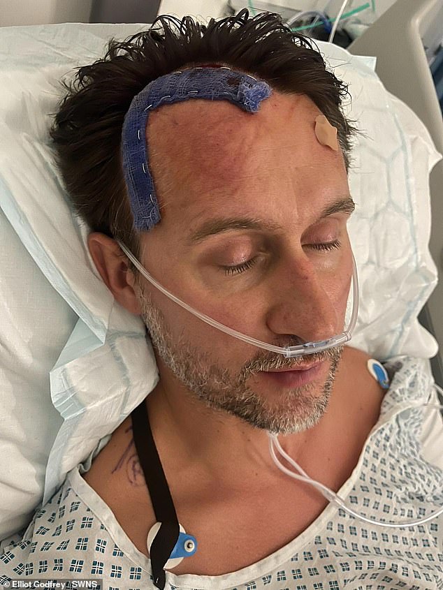 The 42-year-old dismissed the headaches as merely the stress and tiredness of being a new dad. Pictured, Mr Godfrey in hospital after brain surgery