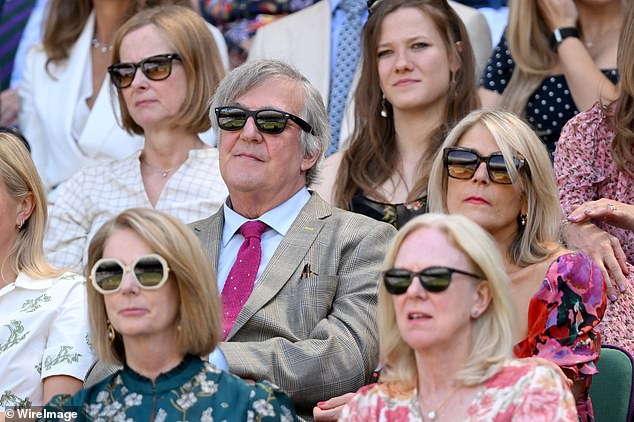 Former Australian Prime Minister Julia Gillard (bottom left) was pictured in the Royal Box at Wimbledon on Thursday afternoon in front of Sir Steven Fry