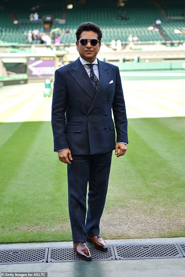 Indian former international cricketer Sachin Tendulkar looked very smart in a navy suit and brown shoes