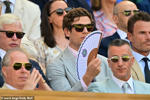 He kept cool during the match with a branded Wimbledon fan