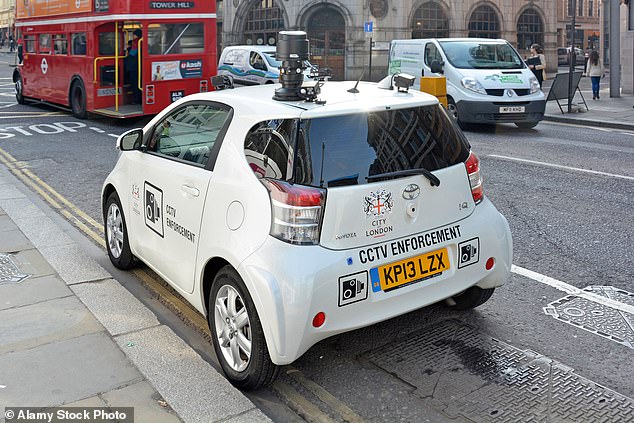 A CCTV enforcement vehicle parked on double yellow lines near box junction in the City of London