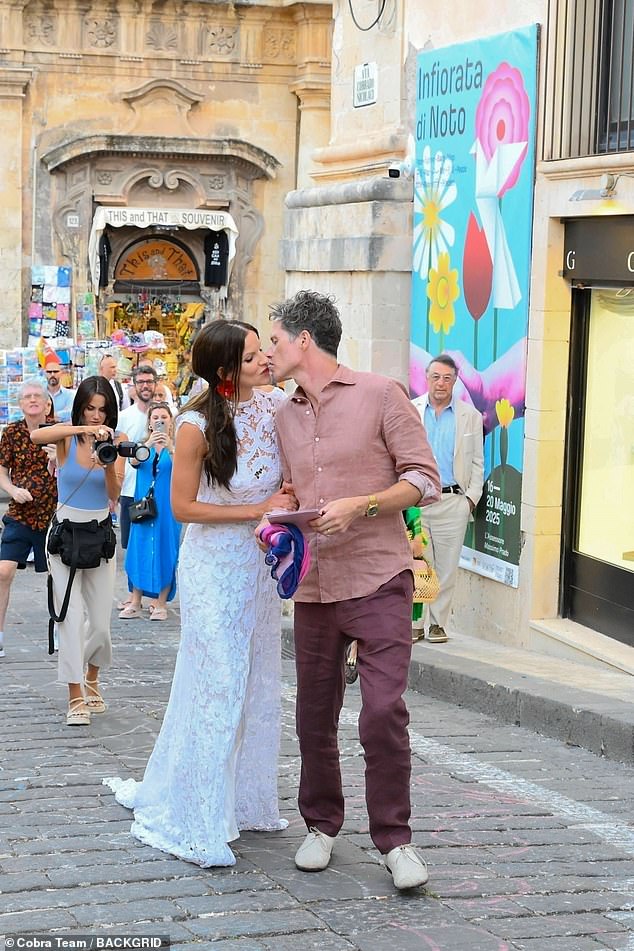 Sting's daughter Fuchsia Kate Sumner, 43, looked out of this world in a lace bridal gown as she kissed her groom during their extravagant pre-wedding street bash on Friday