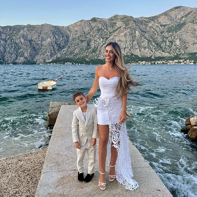 The mother-of-two (pictured with one of her sons) has been posting regularly from her travels in Montenegro, while her estranged husband works in wintry Melbourne