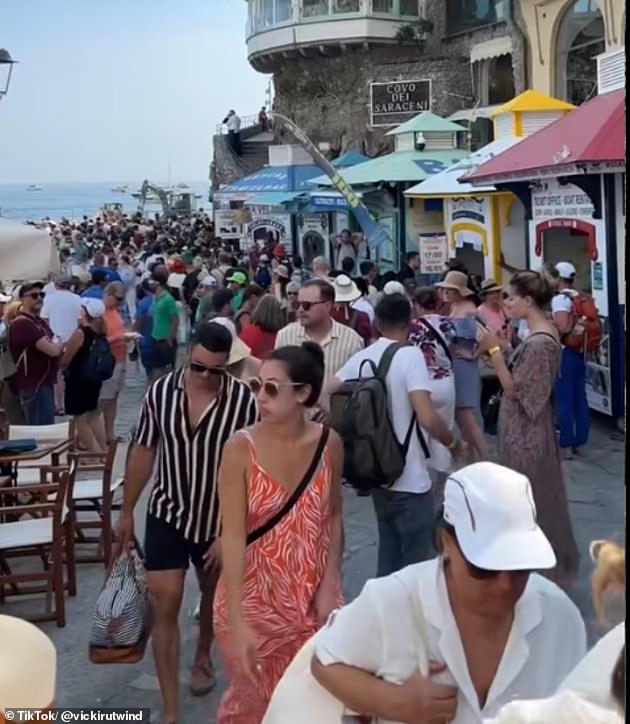 She wrote: 'I was expecting all of the stairs, but I wasn't expecting the magnitude of the crowds and the lineups.' Pictured: The crowds in Positano