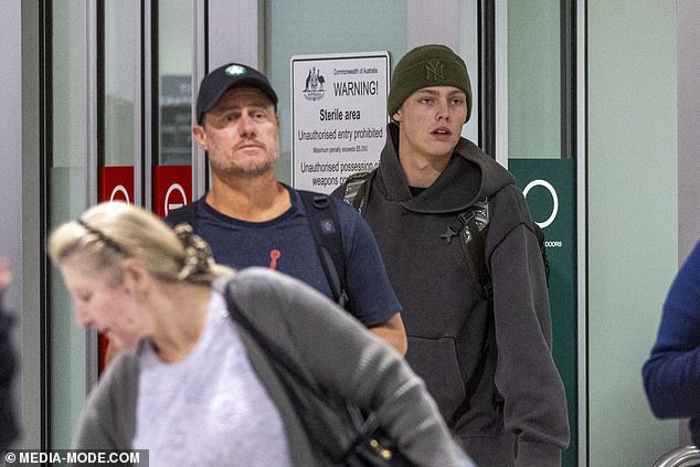 Father-and-son Lleyton and Cruz Hewitt looked strained as they touched down at Melbourne Airport on Tuesday, following the young tennis prodigy's Wimbledon appearance