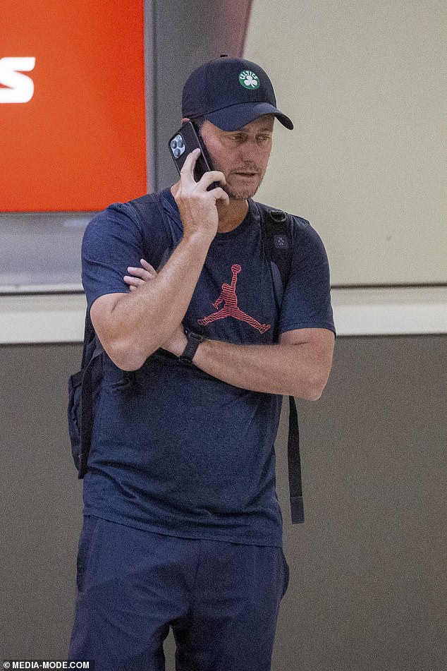 The former world No. 1 was seen having a tense phone call while waiting at baggage claim