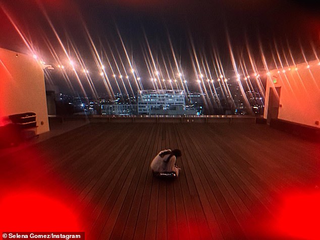 As part of her snapshot, she also shared  a snapshot of herself sitting alone in the middle of the large rooftop space at one point at the end of the party