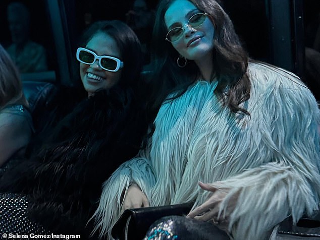 At some points during the soirée and in her party snaps, Gomez wore a cream-colored, faux fur coat over her sparkly garb and also wore a pair of oval-shaped, green-tinted sunnies for her circa 70s party theme