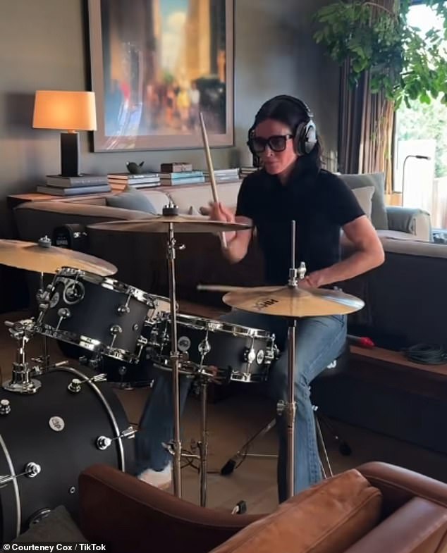 Courteney Cox, 61, sent her fans into a frenzy as she shared a clip playing drums to a Justin Bieber hit