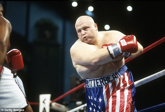 Butterbean fights Doug Phillips during a heavy weight boxing match on December 6, 1997