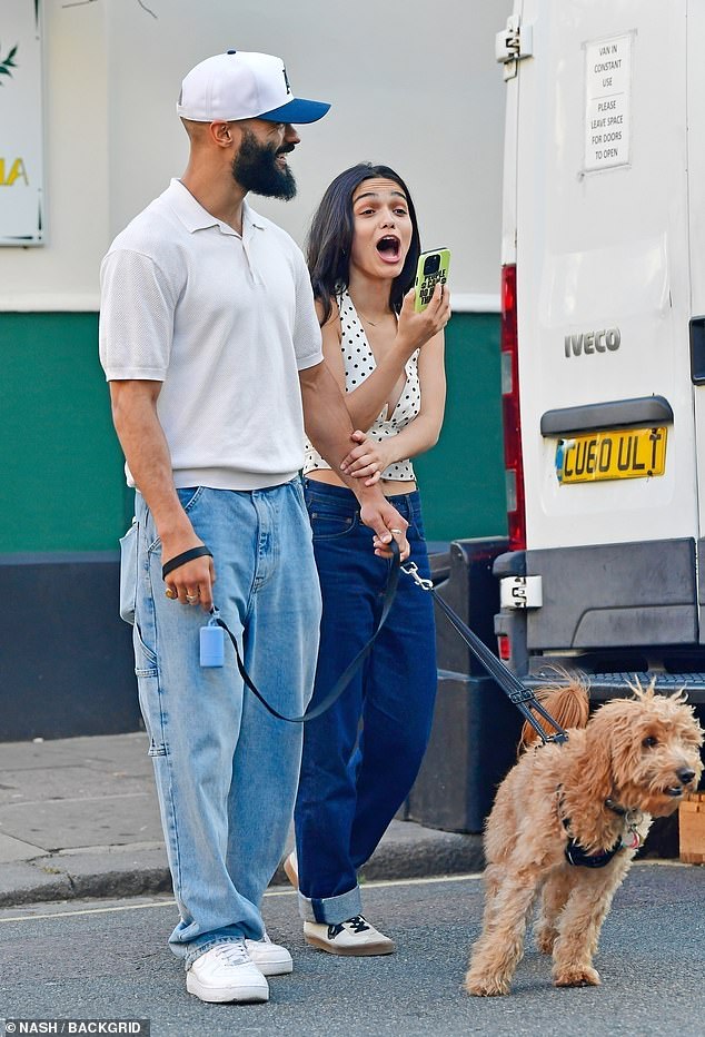 Rachel beamed as she grabbed Nathan's arm as they walked their adorable pet pooch ahead of taking to the stage at the Palladium in the evening