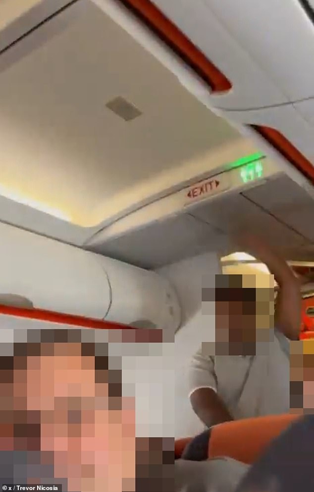 Terrifying moment easyJet passenger yells 'I've got a bomb' on packed flight before hero pins him down