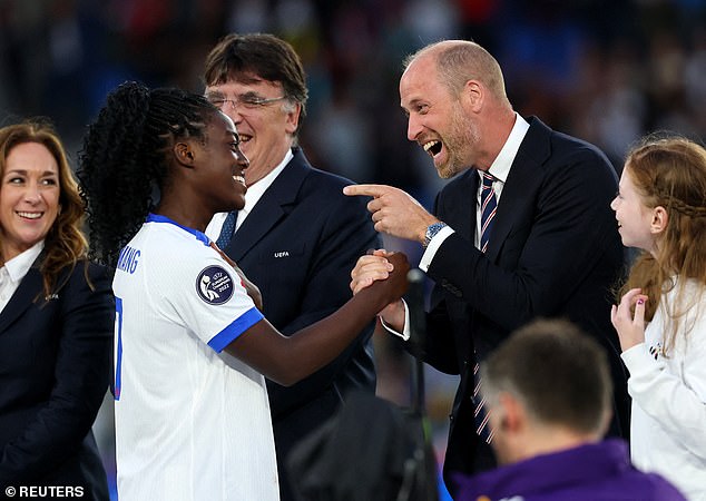ngland's Michelle Agyemang with Britain's Prince William during the trophy ceremony