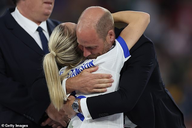 William, Prince of Wales celebrates with Leah Williamson