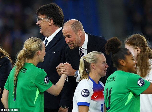 England's Hannah Hampton shakes hands with Prince William