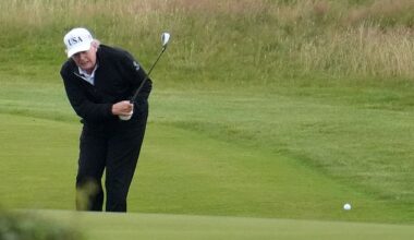 Video of President Donald Trump receiving 'help' from a caddie on the course went viral
