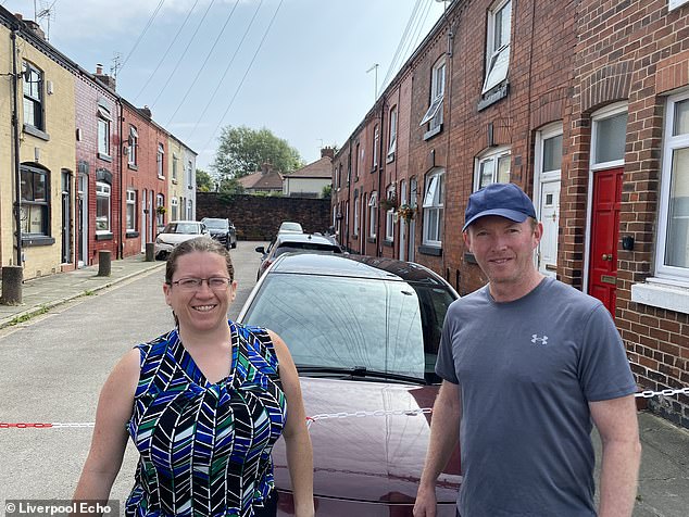 Tourists Holly Andrews and Scott Tucker were amongst those visiting Arnold Grove to view George Harrison's former home - from behind the chain