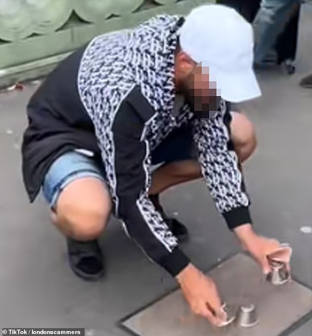 Swindlers tricking visitors into betting on impossible-to-win 'cup and ball' games have become a common sight on the bridge, which is next to the Houses of Parliament