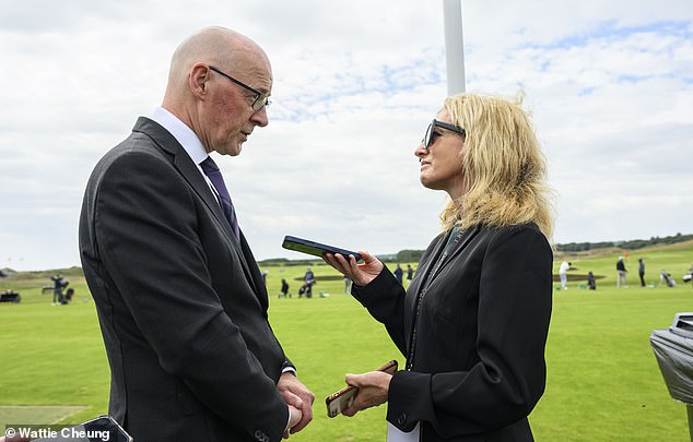 First Minister John Swinney talks to Mail Sport's Heather Dewar at the opening of Donald Trump's new golf course in Aberdeenshire on Tuesday