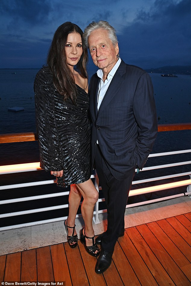 Catherine Zeta-Jones has detailed her surprisingly low-key family staycations with her husband Michael Douglas (pictured in 2023) and their two kids