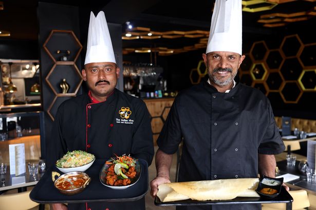 Sebastian Joseph and Mathew Lukose with freshly cooked food at The Indian Hive in Wallasey