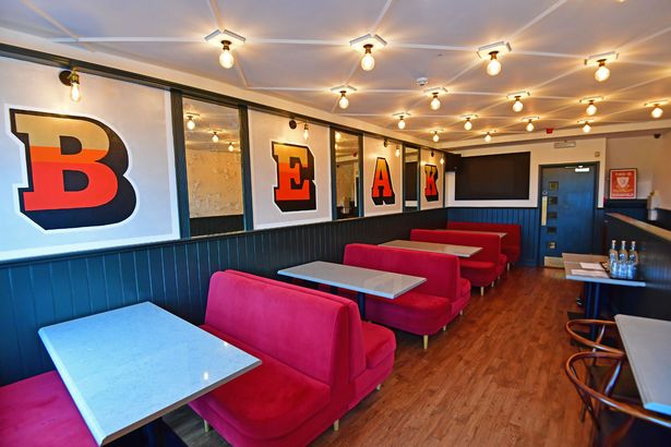 Upstairs with the Beak sign by artist Austin Wilde. Photo by Colin Lane