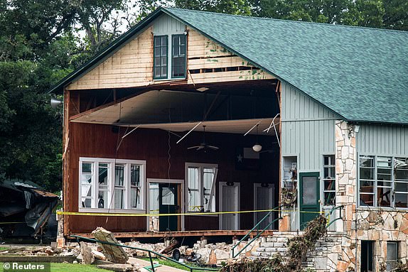 A view of a building missing a wall, in the aftermath of deadly flooding, at Camp Mystic, in Kerr County, Texas, U.S., July 7, 2025.   REUTERS/Sergio Flores