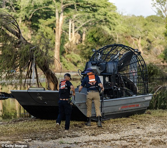 INGRAM, TEXAS - JULY 8: A search and recovery team prepares a fan boat to launch on Guadalupe River while in search of remains of people who were swept up in the flash flooding on July 8, 2025 in Ingram, Texas. Heavy rainfall caused flooding along the Guadalupe River in central Texas with multiple fatalities reported. (Photo by Jim Vondruska/Getty Images)