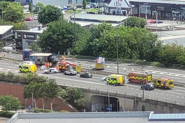 Emergency services at the scene of the major M60 collision