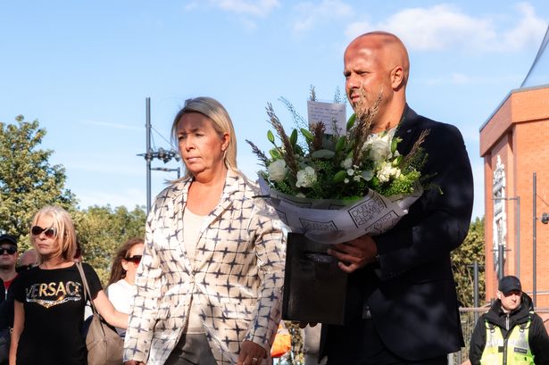 Arne Slot, head coach and his wife paying tribute to Diogo Jota at Anfield