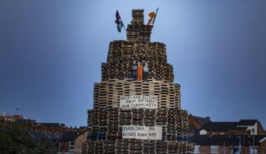 Twelfth, Northern Ireland: Kneecap effigies and Irish language signage appear on controversial Village bonfire