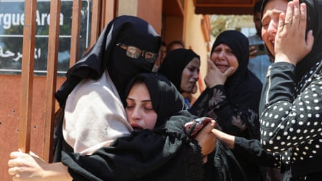 Palestinians mourn people killed while waiting for food near Rafah aid centre – video 