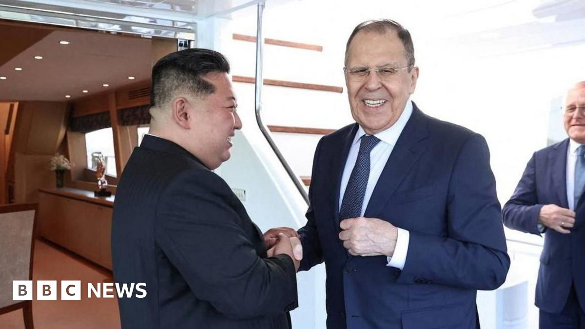 North Korean leader Kim Jong Un shakes hands with Russian Foreign Minister Sergei Lavrov during a meeting in Wonsan, North Korea