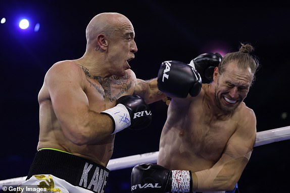 SYDNEY, AUSTRALIA - JULY 16: â¿¿Kane Baker (L) punches Johan Linde during their heavyweight bout at Qudos Bank Arena on July 16, 2025 in Sydney, Australia. (Photo by Darrian Traynor/Getty Images)