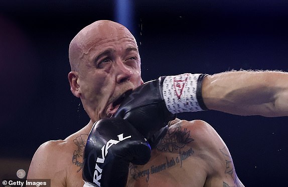 SYDNEY, AUSTRALIA - JULY 16: â¿¿Kane Baker is punches by Johan Linde during their heavyweight bout at Qudos Bank Arena on July 16, 2025 in Sydney, Australia. (Photo by Darrian Traynor/Getty Images)