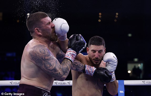 SYDNEY, AUSTRALIA - JULY 16: Kris Terzievski punches Troy Pilcher during their WBA Oceania and WBC Continental Bridgerweight Title bout at Qudos Bank Arena on July 16, 2025 in Sydney, Australia. (Photo by Darrian Traynor/Getty Images)